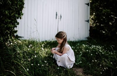 Girl picking flowers